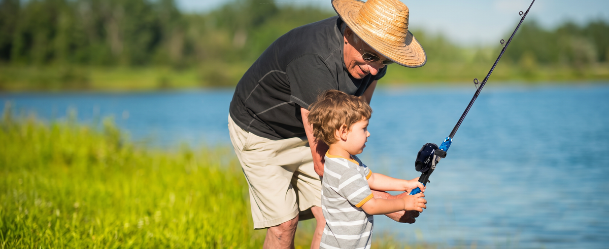 Child using a tangle free fishing pole for kids during a safe family fishing trip.